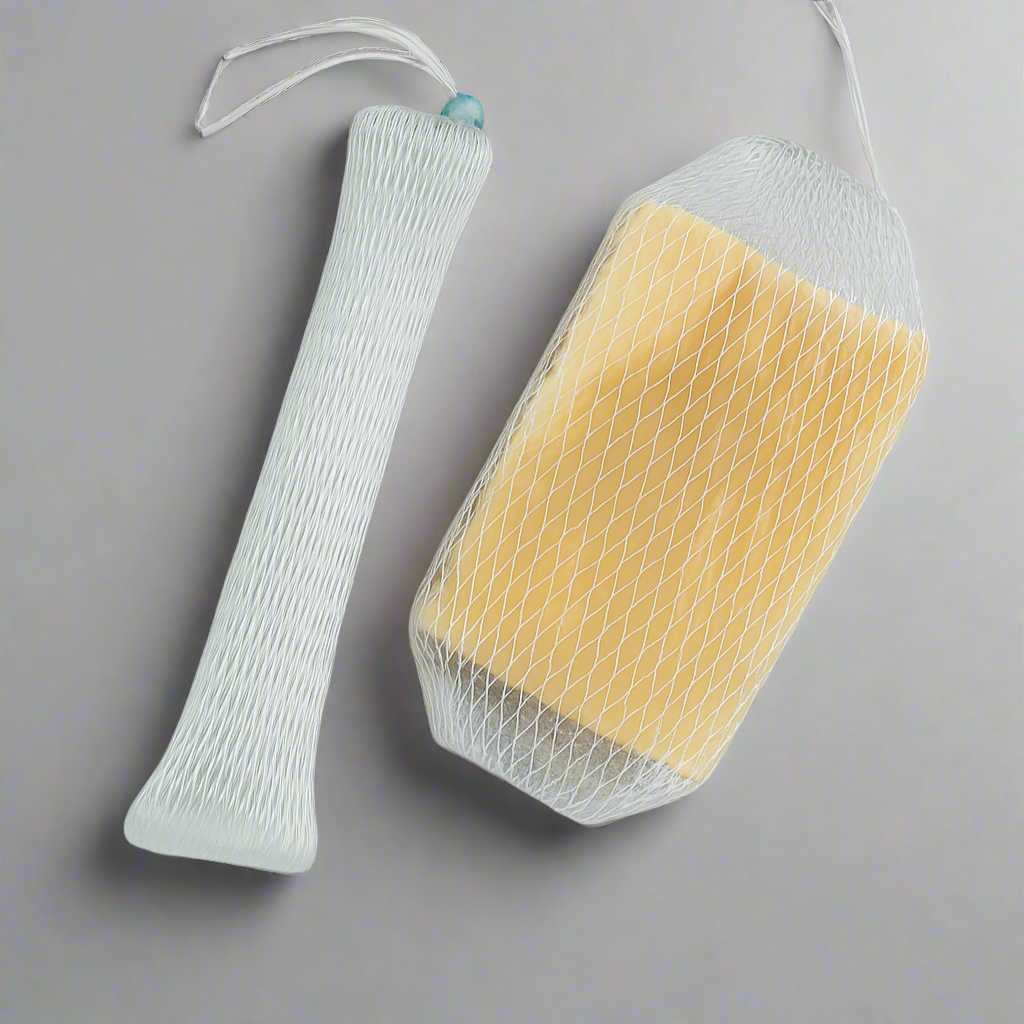 Soap net holding a handmade bar soap, hanging to dry in the shower