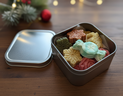 Open tin containing colorful traditional Japanese sweets on a wooden table.